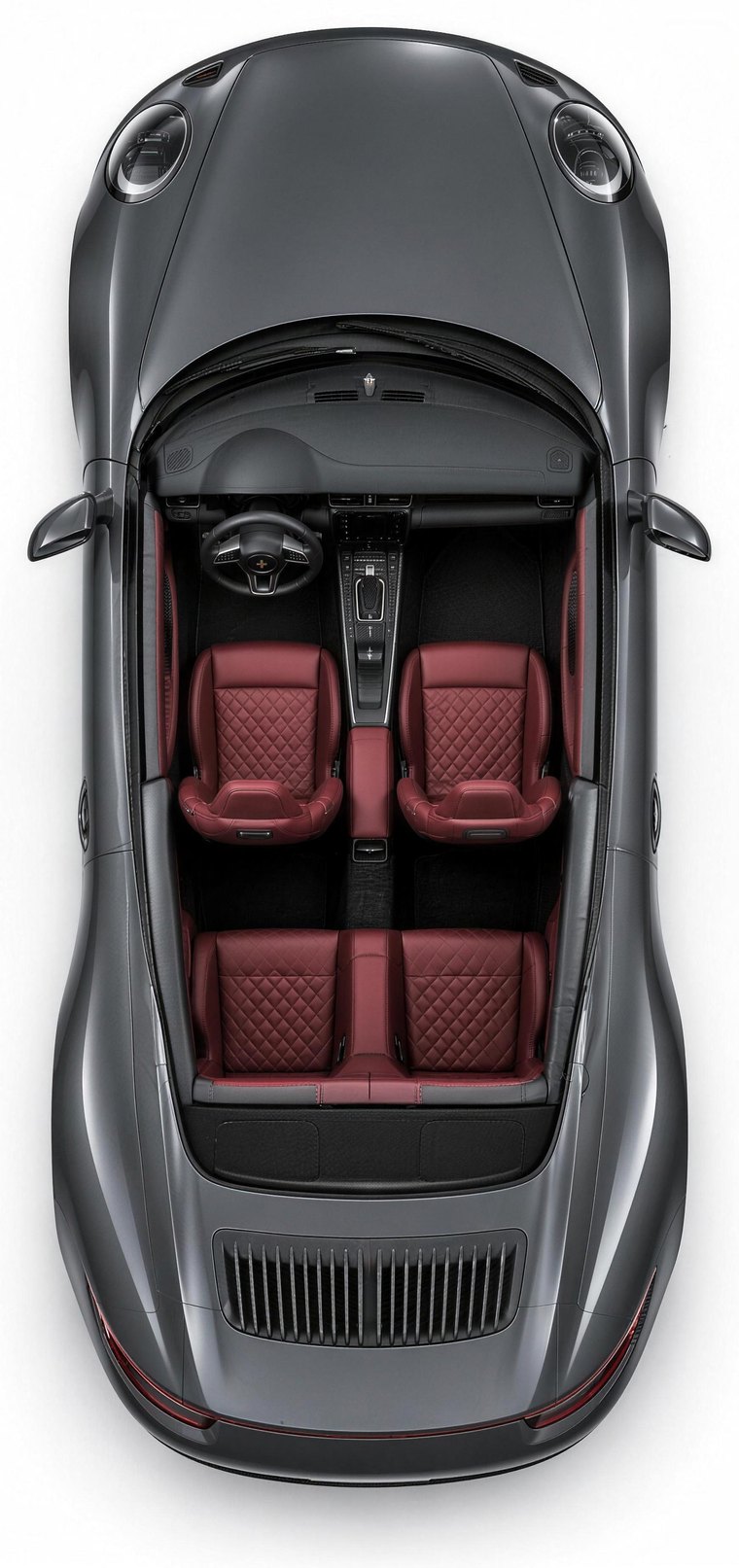 Overhead view of a Porsche 911 with the roof removed, showing oxblood diamond-quilted seats
