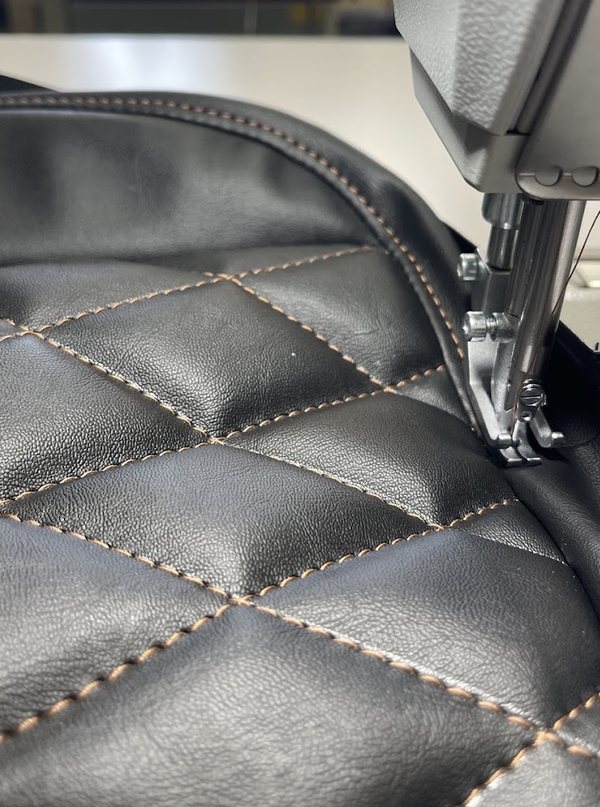 Black diamond quilting being stitched on the machine at the Bhola workshop in Surrey